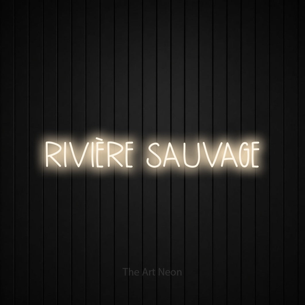 “Rivière sauvage” LED neon sign in warm white, with narrow hand-drawn lettering, shown against black vertical wall slats.