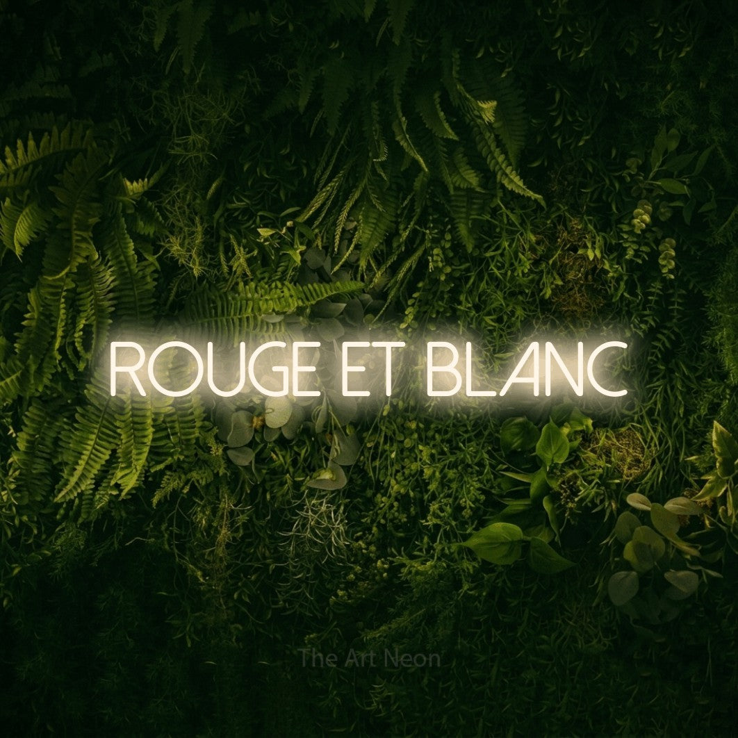 “Rouge et blanc” LED neon sign in warm white, with thin sans-serif lettering, shown against a dark moss and forest backdrop.
