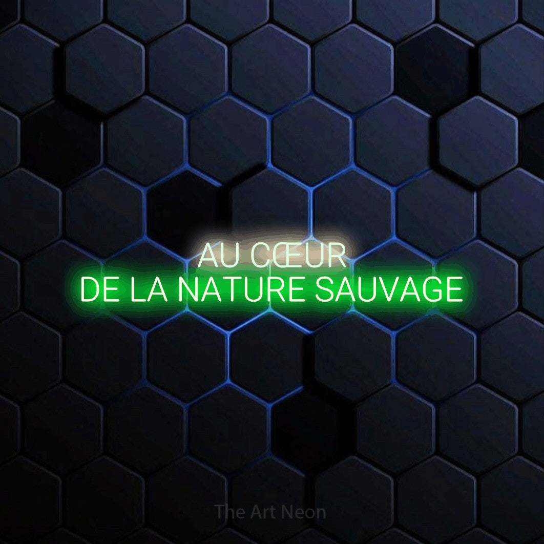 “Au cœur de la nature sauvage” LED neon sign in warm white on the upper line and green on the lower line, with rounded sans-serif lettering across 2 lines, shown against a dark blue honeycomb pattern.