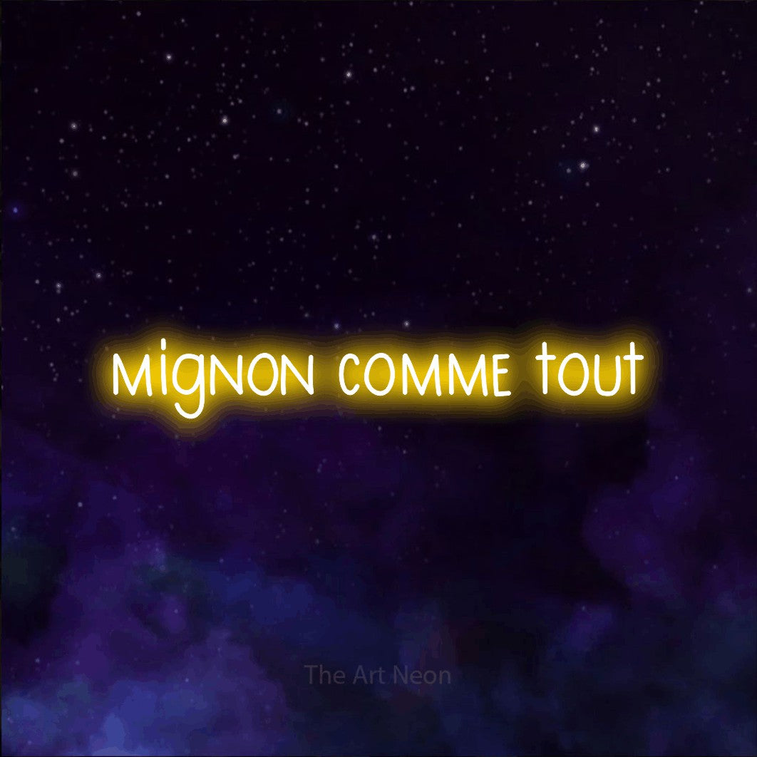 “Mignon comme tout” LED neon sign in yellow, with narrow hand-drawn lettering, shown against a purple galaxy backdrop.