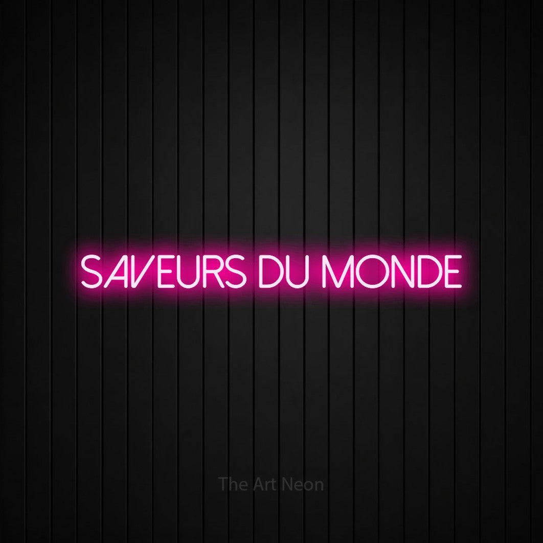 “Saveurs du monde” LED neon sign in hot pink, with thin sans-serif lettering, shown against black vertical wall slats.