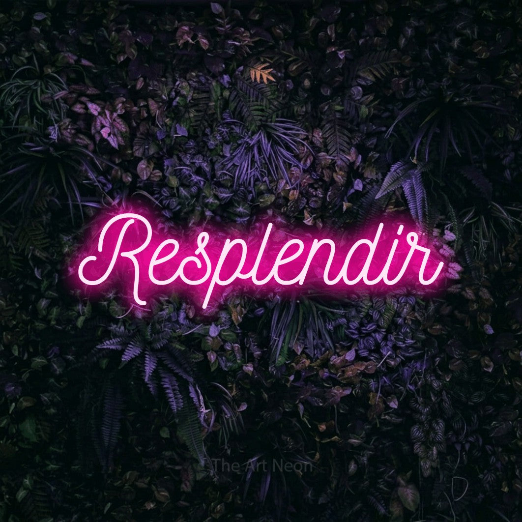 “Resplendir” LED neon sign in hot pink, with ornate cursive lettering, shown against a dark wall with purple flowers.