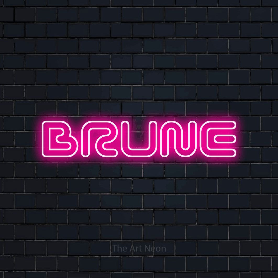 “Brune” LED neon sign in hot pink, with futuristic double-line lettering, shown against a dark navy brick wall.
