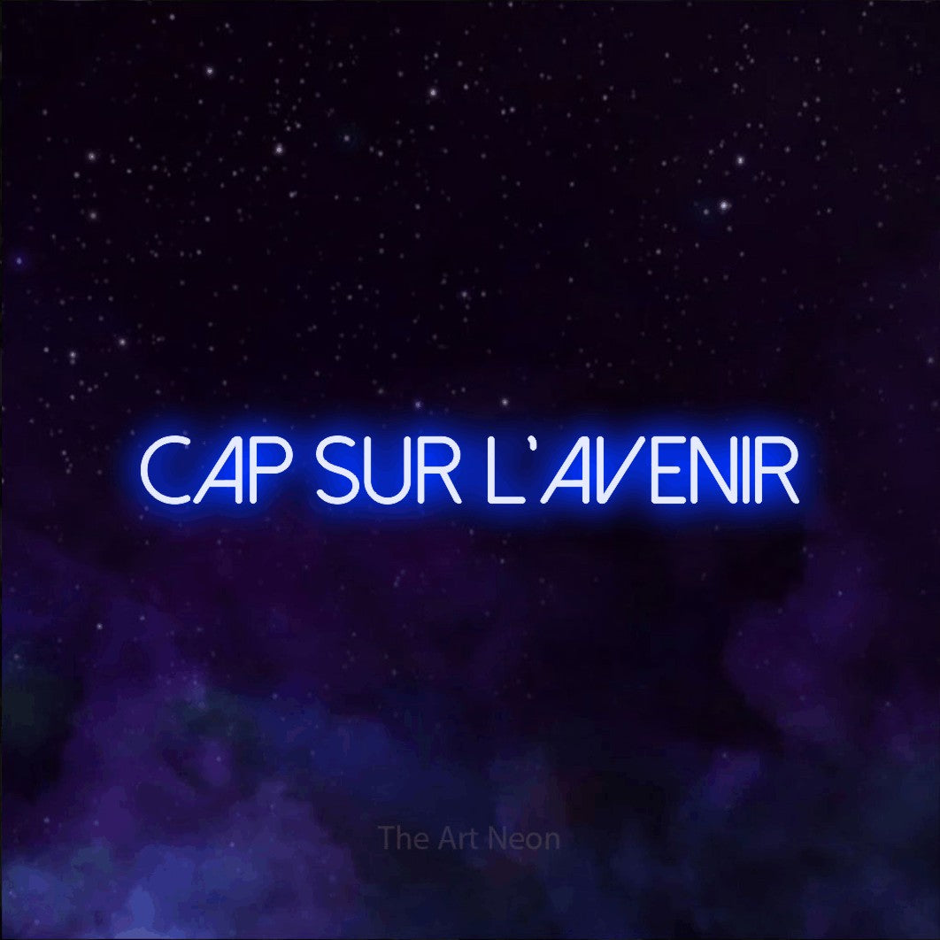 “Cap sur l'avenir” LED neon sign in blue, with thin sans-serif lettering, shown against a purple galaxy backdrop.