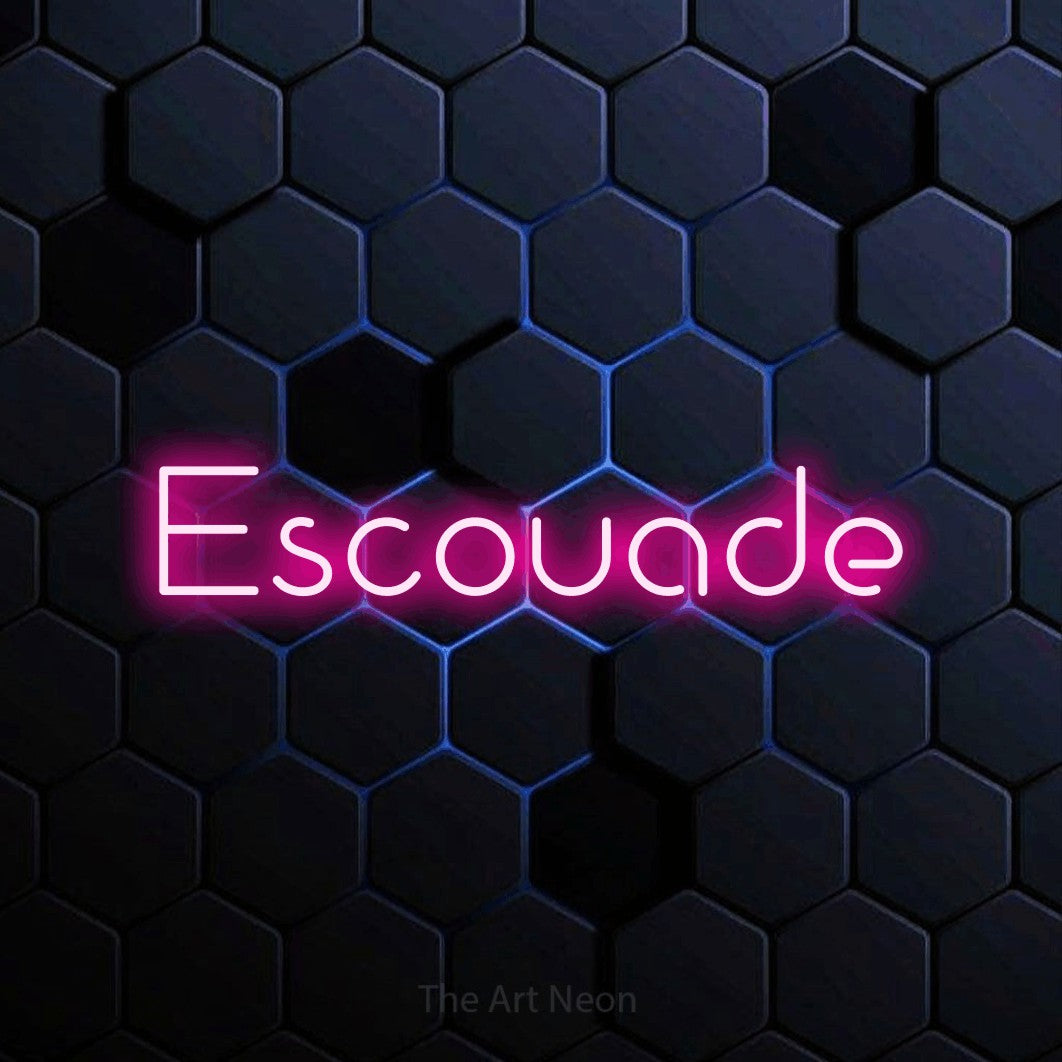 “Escouade” LED neon sign in hot pink, with stylised geometric lettering, shown against a dark blue honeycomb pattern.