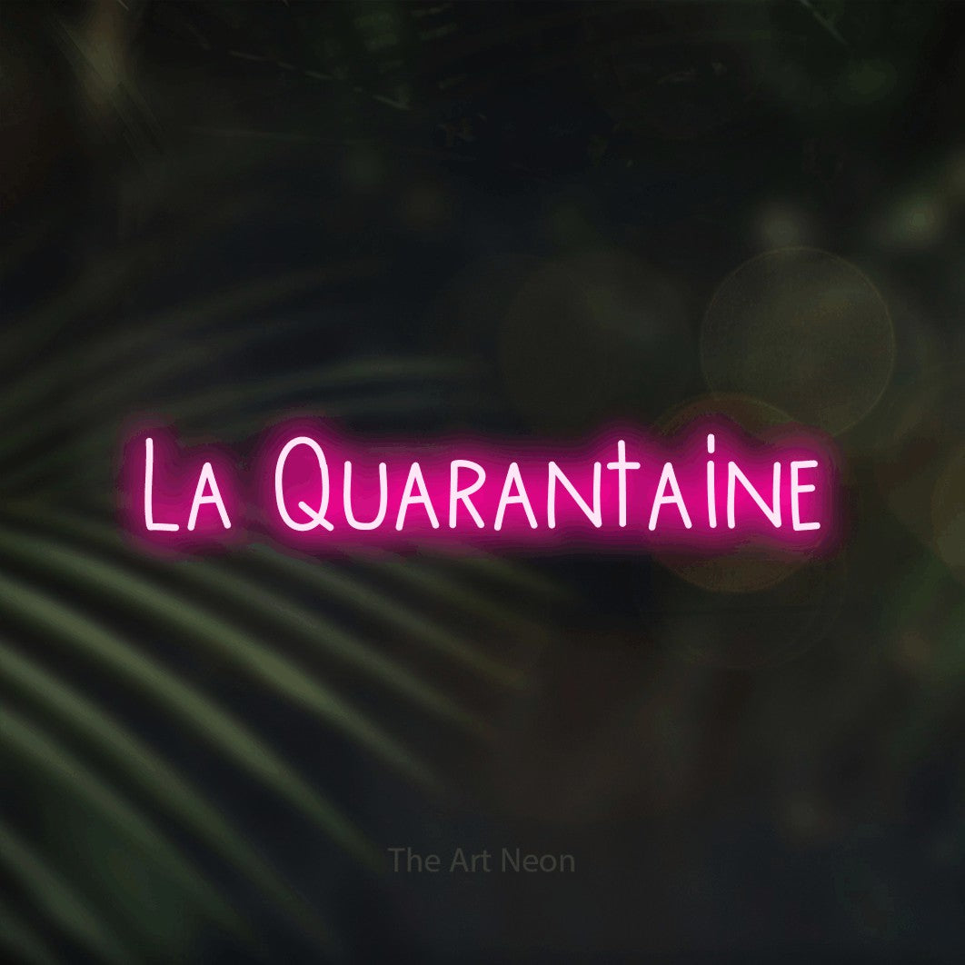 “La quarantaine” LED neon sign in hot pink, with narrow hand-drawn lettering, shown against a blurred palm and bokeh-light backdrop.