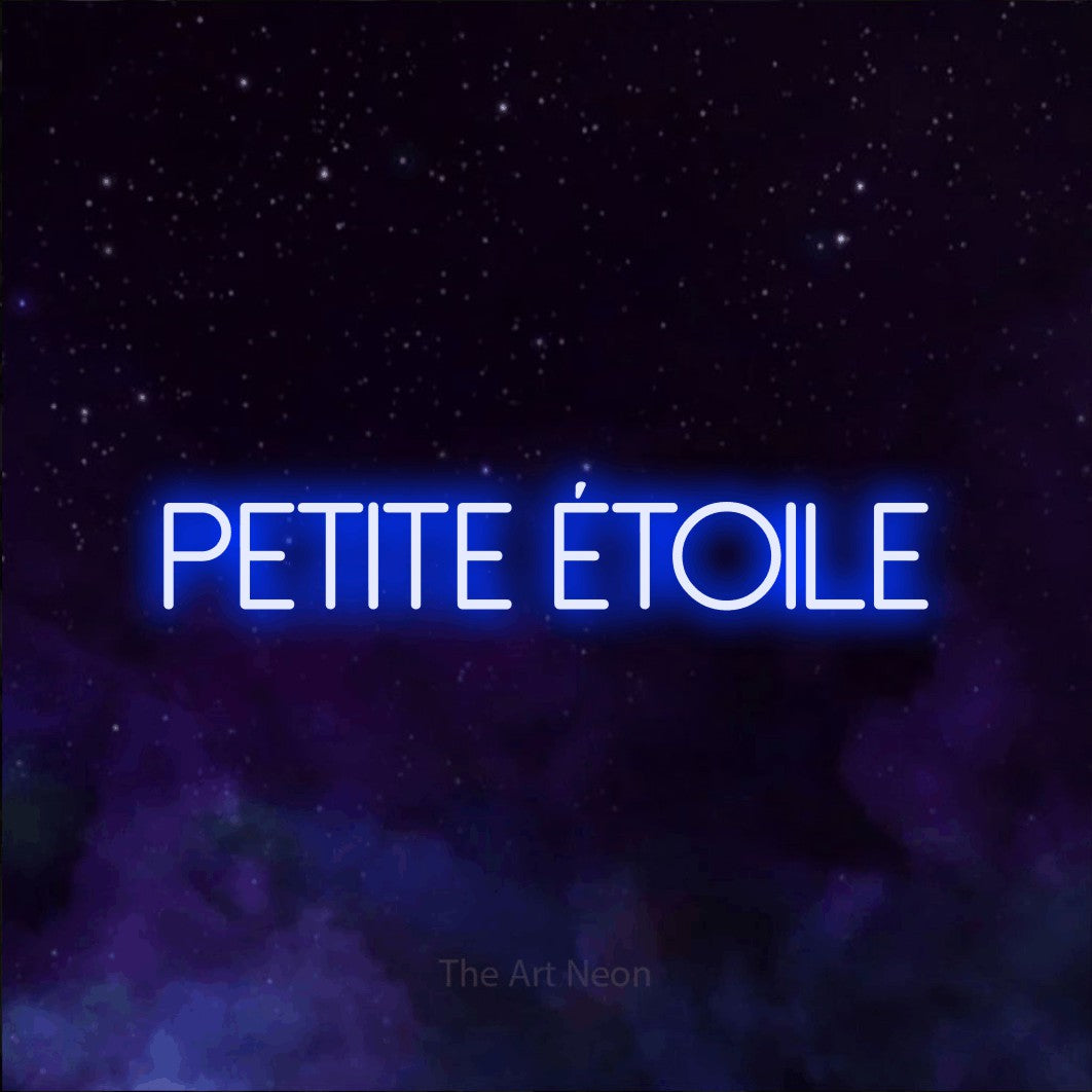 “Petite étoile” LED neon sign in blue, with thin sans-serif lettering, shown against a purple galaxy backdrop.