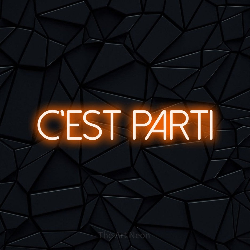 “C'est parti” LED neon sign in orange, with thin sans-serif lettering, shown against a black polygonal surface.