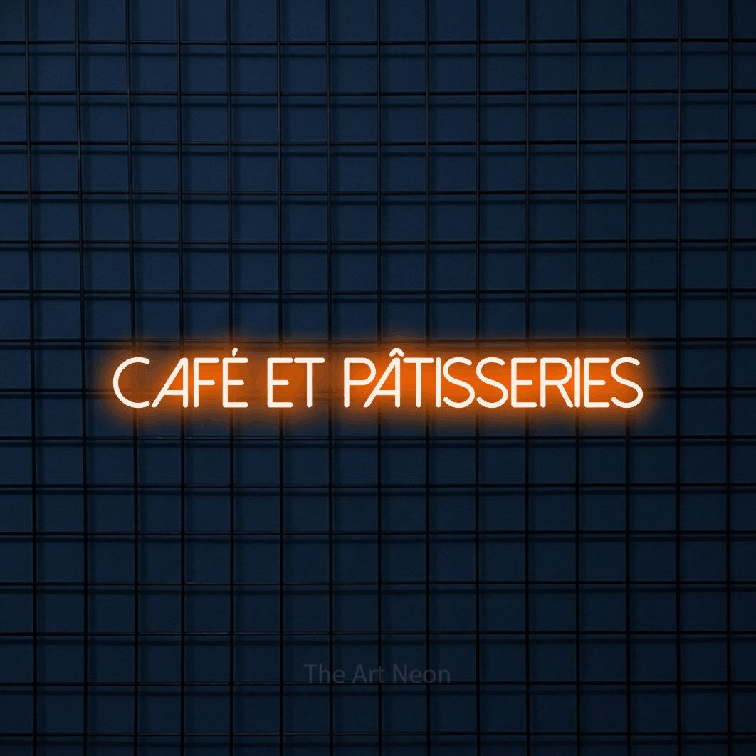 “Café et pâtisseries” LED neon sign in orange, with thin sans-serif lettering, shown against a dark blue grid.