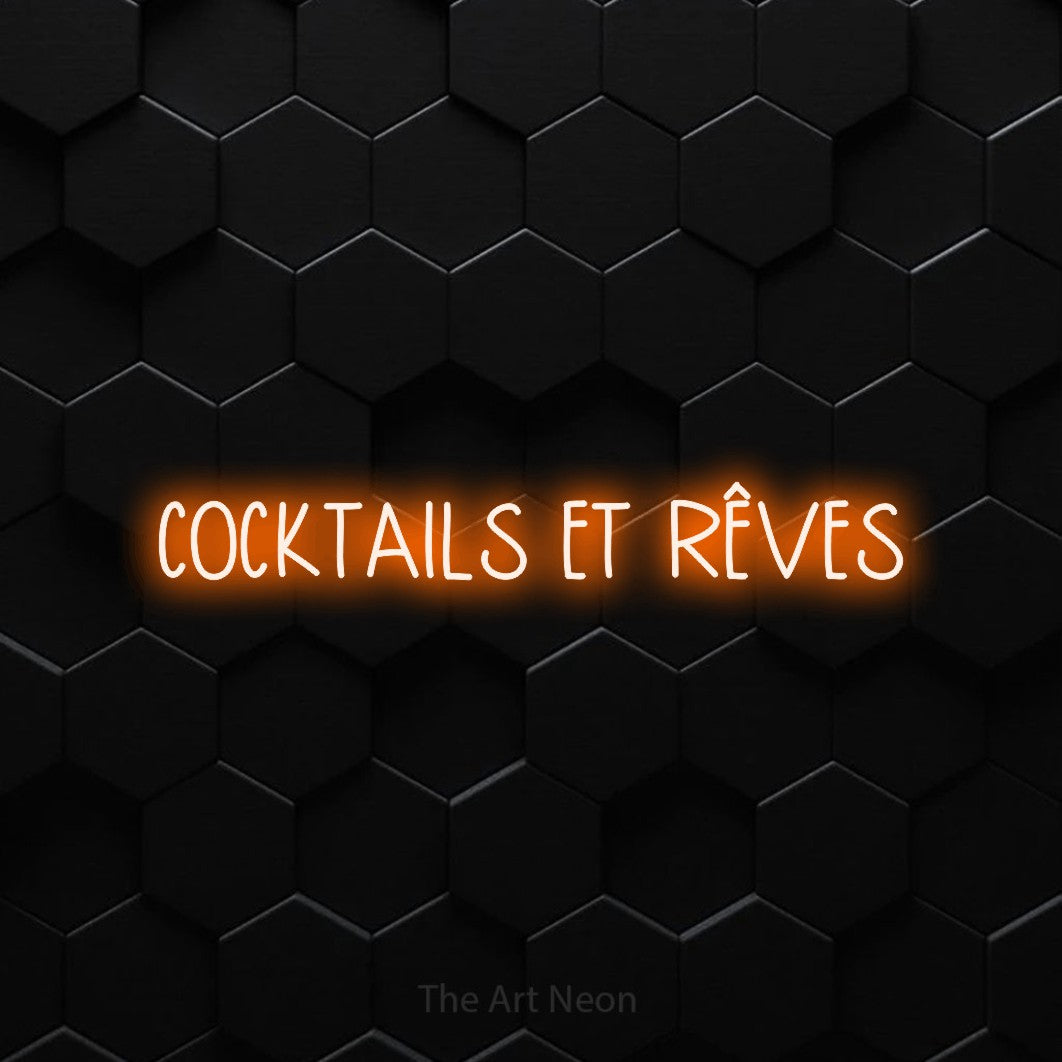 “Cocktails et rêves” LED neon sign in orange, with narrow hand-drawn lettering, shown against black hexagonal wall tiles.