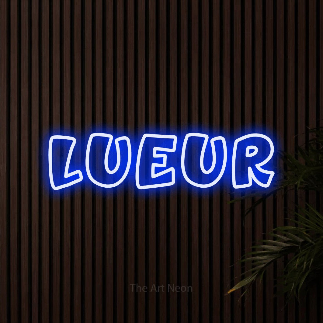 “Lueur” LED neon sign in blue, with rounded outline lettering, shown against dark wooden wall slats.