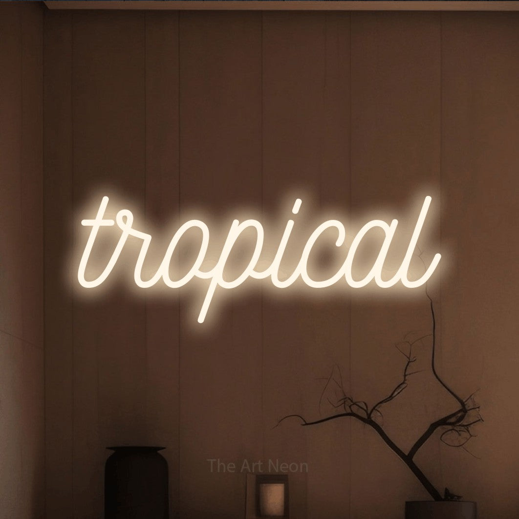 “Tropical” LED neon sign in warm white, with ornate cursive lettering, shown against a simple earth-toned interior.
