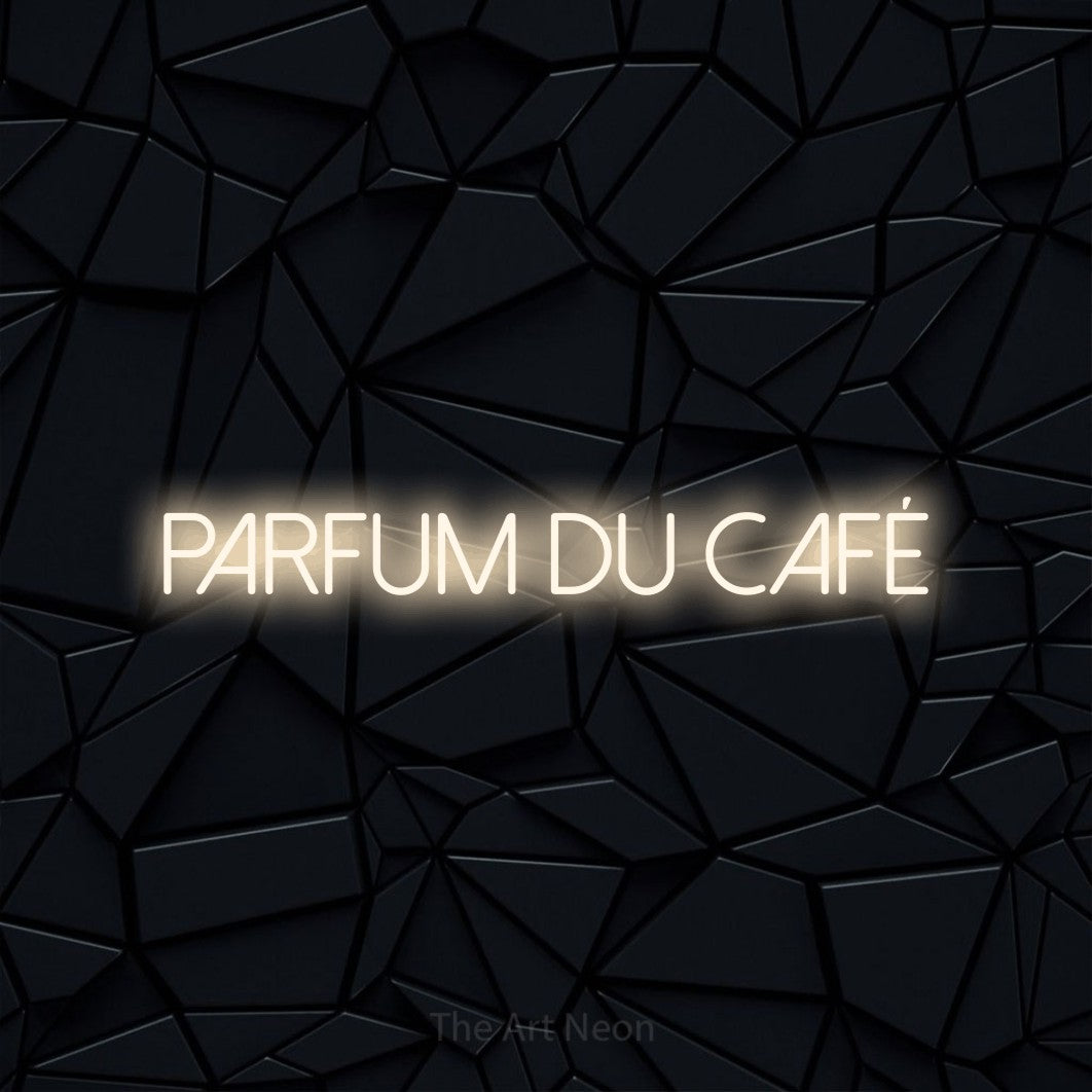 Enseigne néon LED « Parfum du café » en blanc chaud, en lettres fines sans empattement, présentée sur une surface polygonale noire, pour un café.