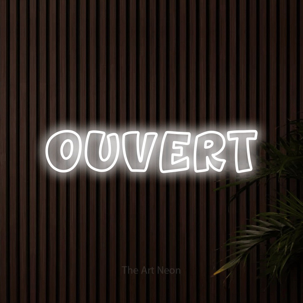 “Ouvert” LED neon sign in cool white, with rounded outline lettering, shown against dark wooden wall slats.