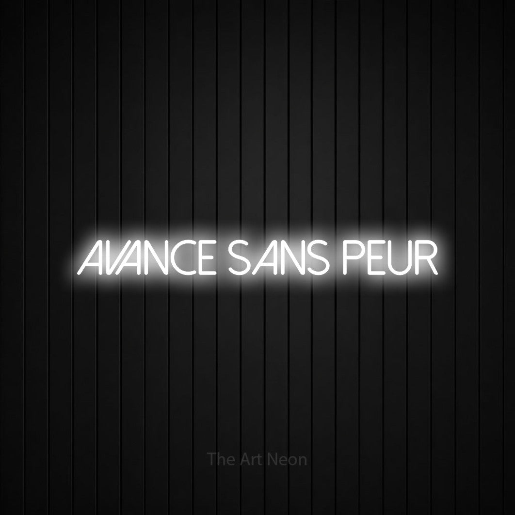 “Avance sans peur” LED neon sign in cool white, with thin sans-serif lettering, shown against black vertical wall slats.