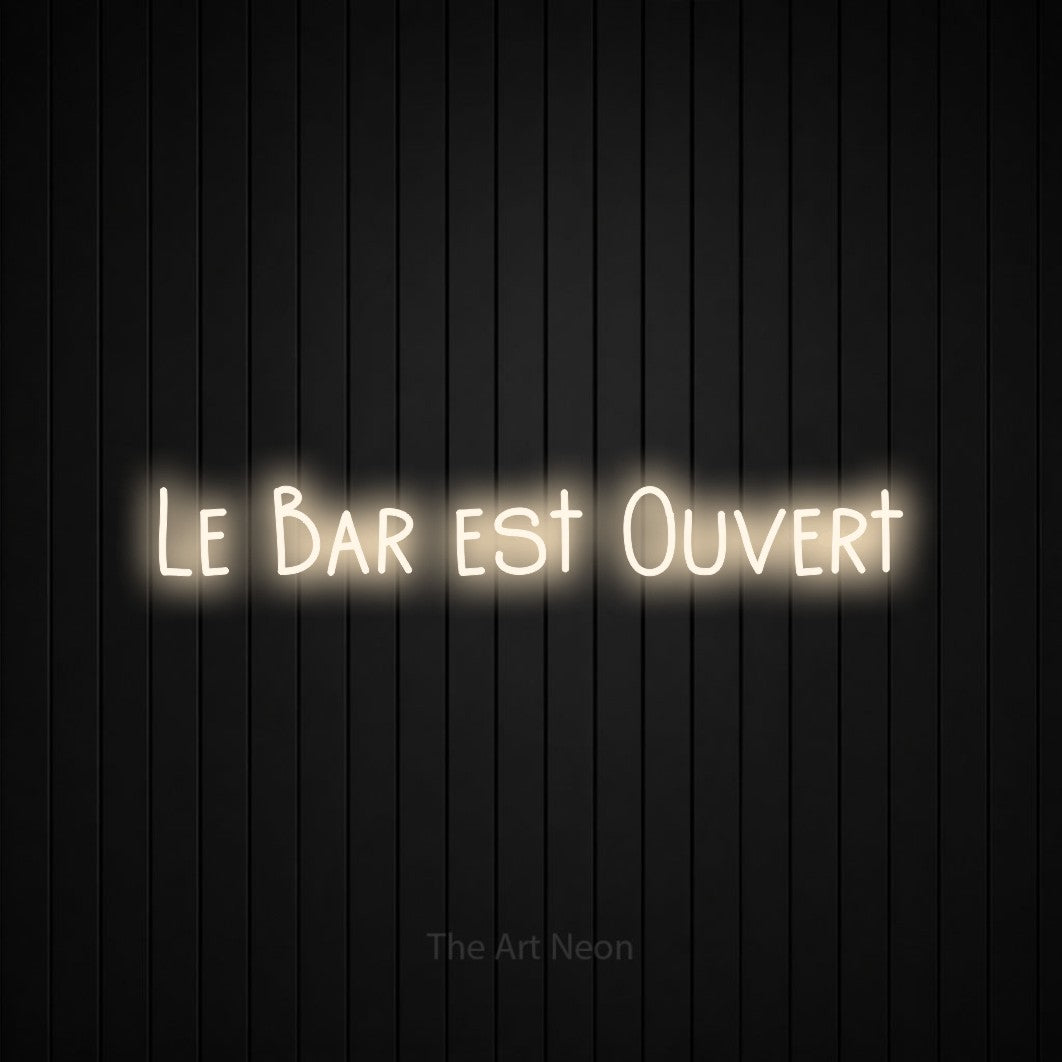“Le bar est ouvert” LED neon sign in warm white, with narrow hand-drawn lettering, shown against black vertical wall slats.