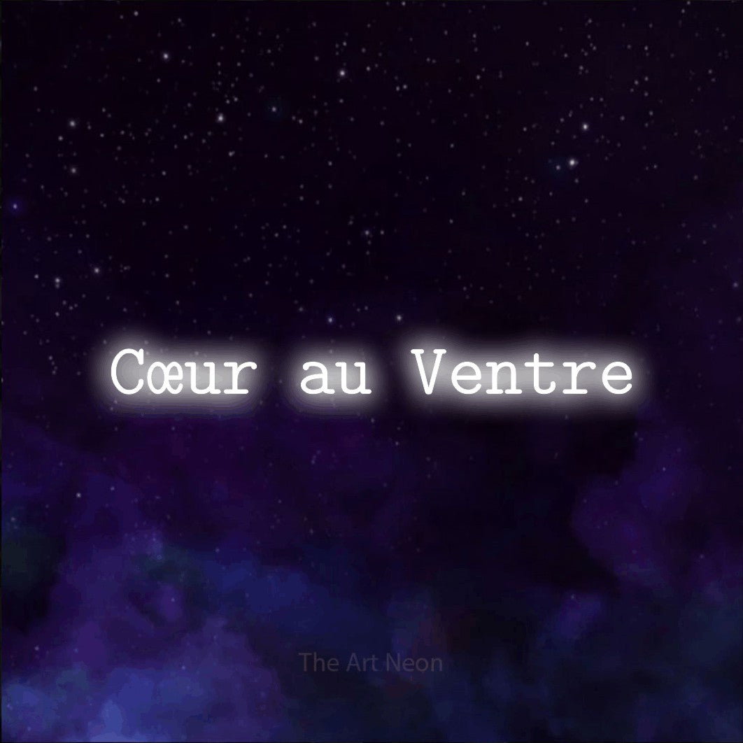 “Cœur au ventre” LED neon sign in cool white, with typewriter-style lettering, shown against a purple galaxy backdrop.