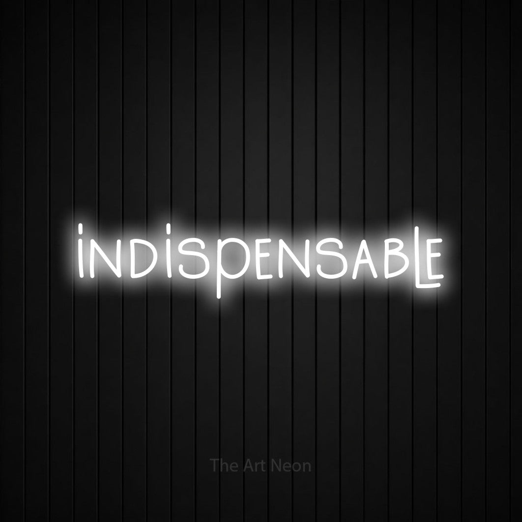 “Indispensable” LED neon sign in cool white, with narrow hand-drawn lettering, shown against black vertical wall slats.