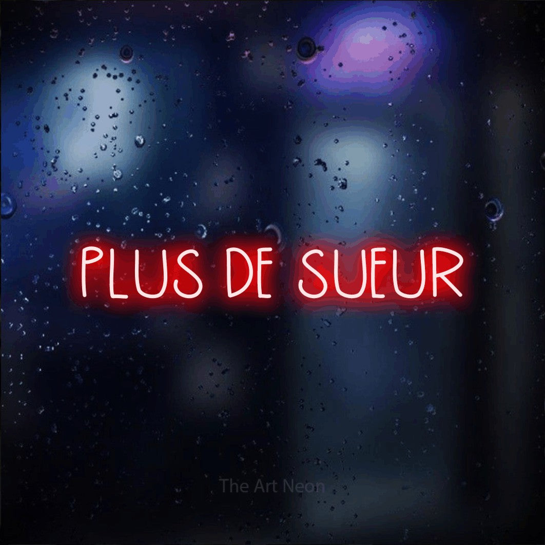 “Plus de sueur” LED neon sign in red, with narrow hand-drawn lettering, shown against glass with blue and purple reflections.