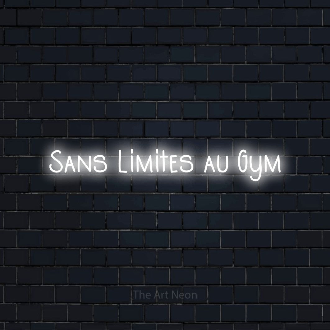 “Sans limites au gym” LED neon sign in cool white, with narrow hand-drawn lettering, shown against a dark navy brick wall.