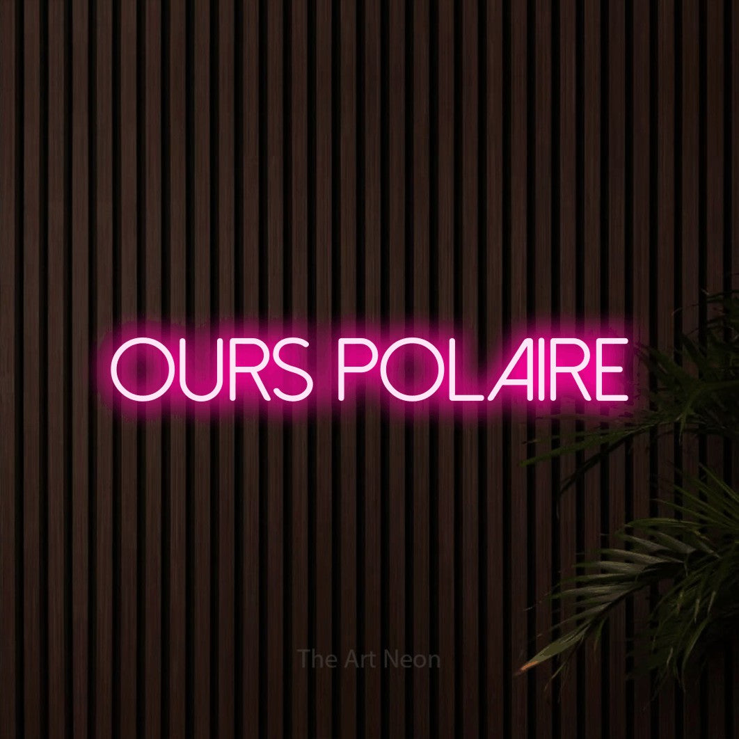 “Ours polaire” LED neon sign in hot pink, with thin sans-serif lettering, shown against dark wooden wall slats.