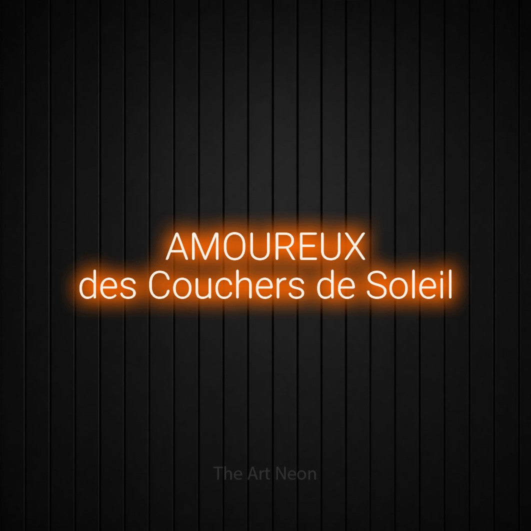 “Amoureux des couchers de soleil” LED neon sign in orange, with rounded sans-serif lettering across 2 lines, shown against black vertical wall slats.