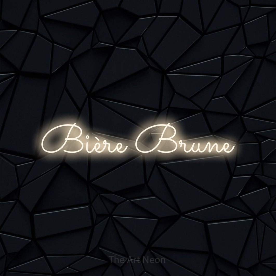 “Bière brune” LED neon sign in warm white, with looped cursive lettering, shown against a black polygonal surface.