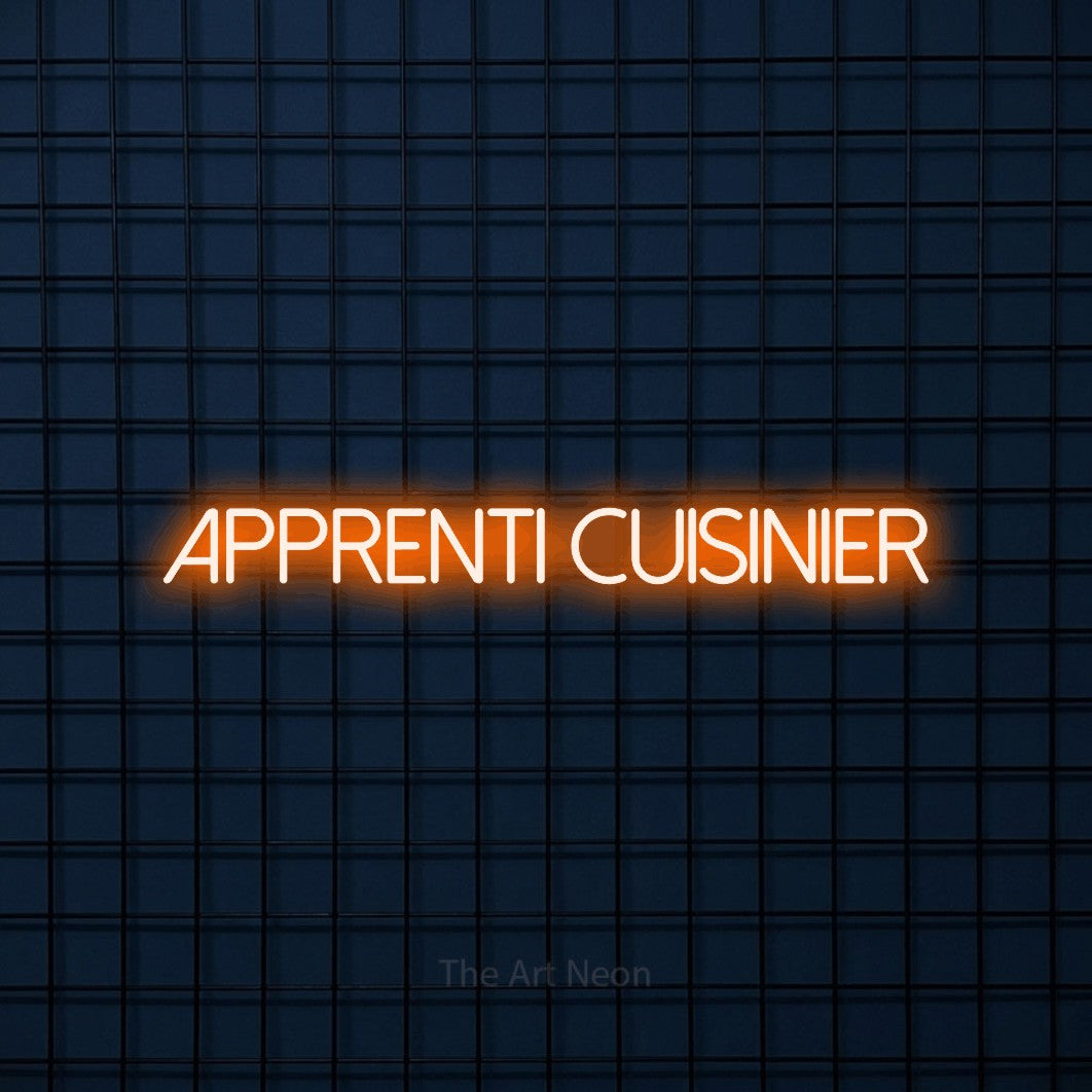 “Apprenti cuisinier” LED neon sign in orange, with thin sans-serif lettering, shown against a dark blue grid.