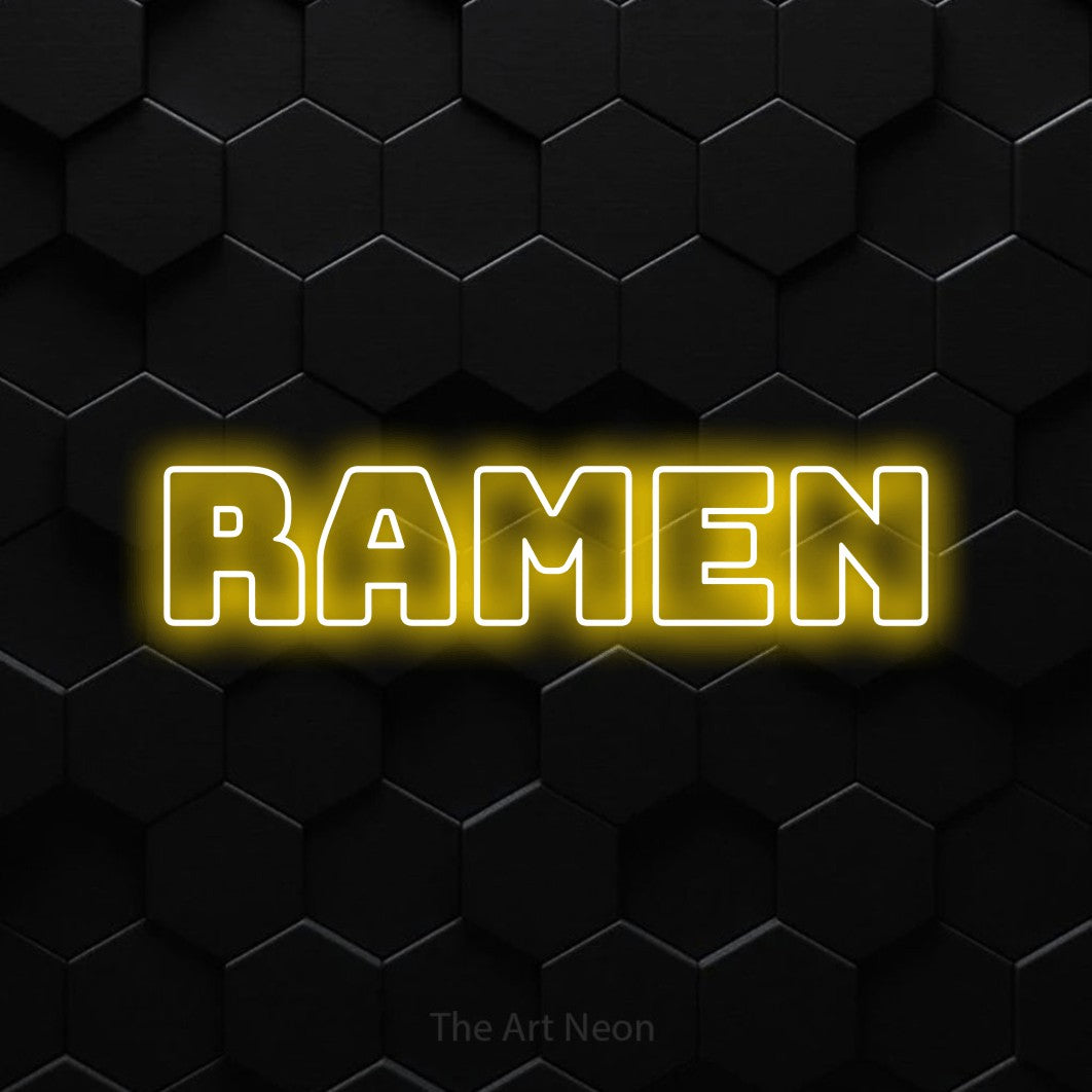 “Ramen” LED neon sign in yellow, with bold outline lettering, shown against black hexagonal wall tiles.