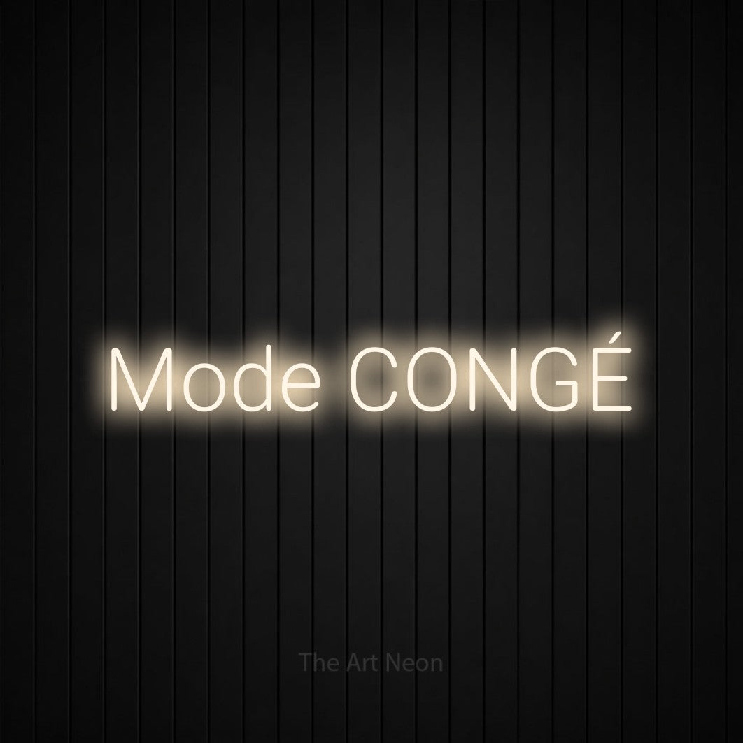 “Mode congé” LED neon sign in warm white, with rounded sans-serif lettering, shown against black vertical wall slats.