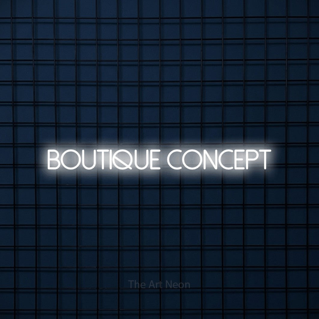 “Boutique concept” LED neon sign in cool white, with thin sans-serif lettering, shown against a dark blue grid.