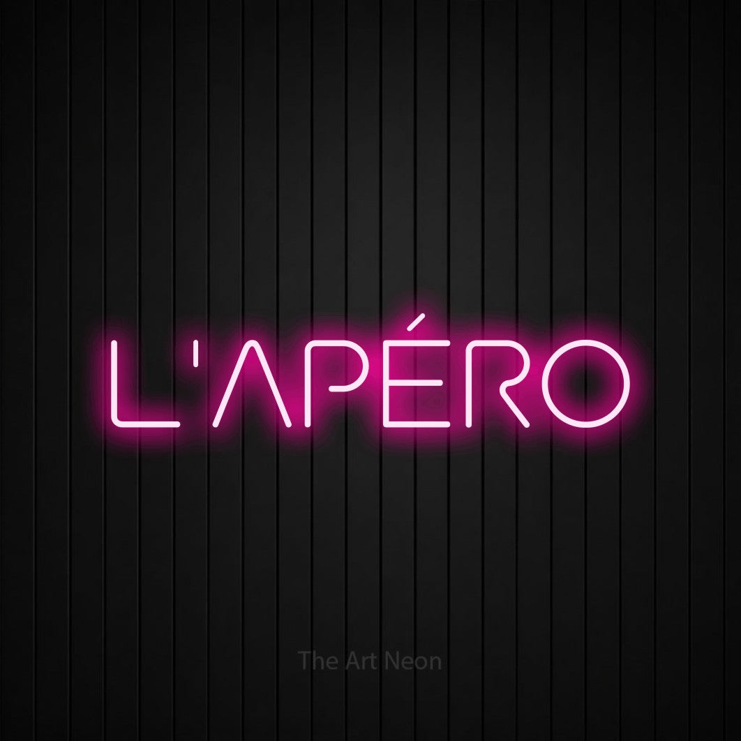 “L'apéro” LED neon sign in hot pink, with stylised geometric lettering, shown against black vertical wall slats.