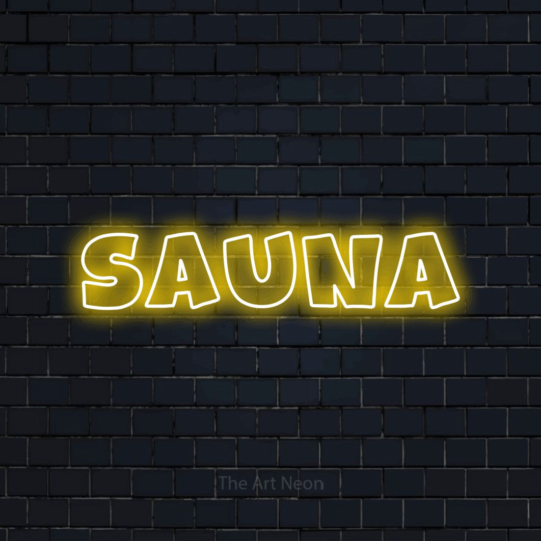 “Sauna” LED neon sign in yellow, with wide lettering with irregular outlines, shown against a dark navy brick wall.