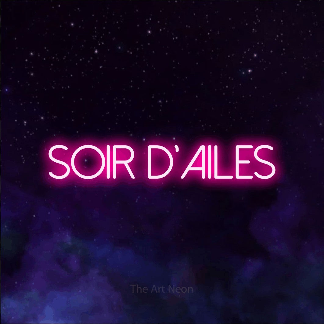 “Soir d'ailes” LED neon sign in hot pink, with thin sans-serif lettering, shown against a purple galaxy backdrop.