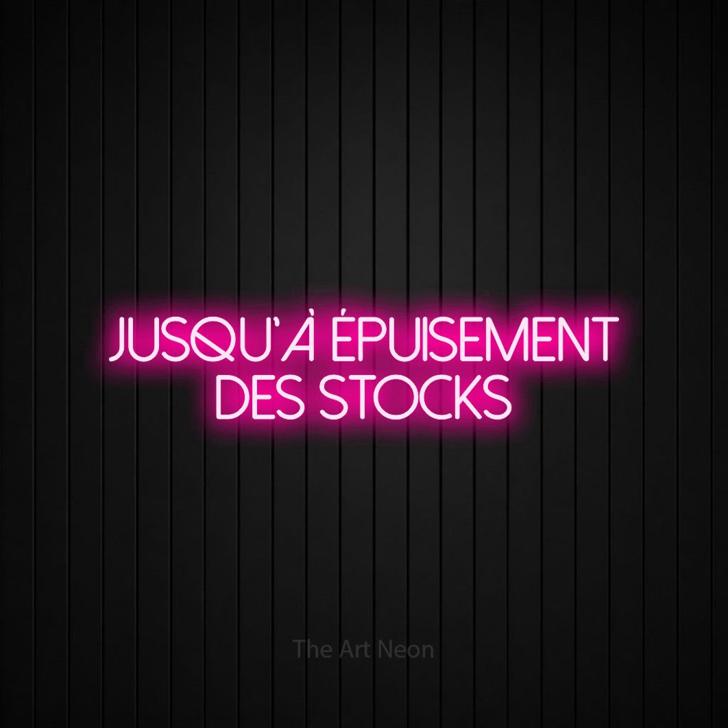 “Jusqu'à épuisement des stocks” LED neon sign in hot pink, with thin sans-serif lettering across 2 lines, shown against black vertical wall slats.
