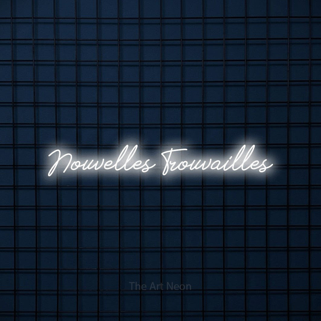 “Nouvelles trouvailles” LED neon sign in cool white, with cursive lettering, shown against a dark blue grid.