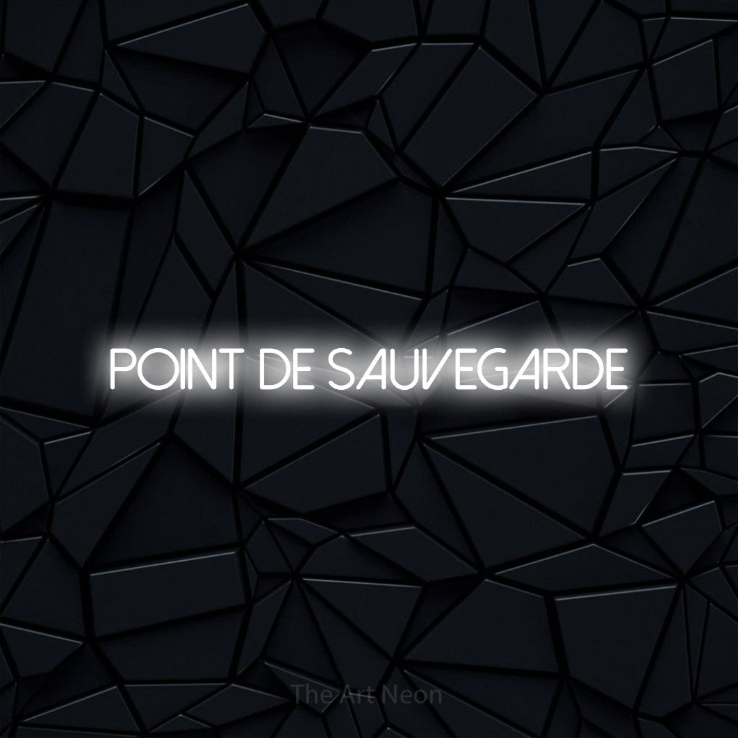 “Point de sauvegarde” LED neon sign in cool white, with thin sans-serif lettering, shown against a black polygonal surface.