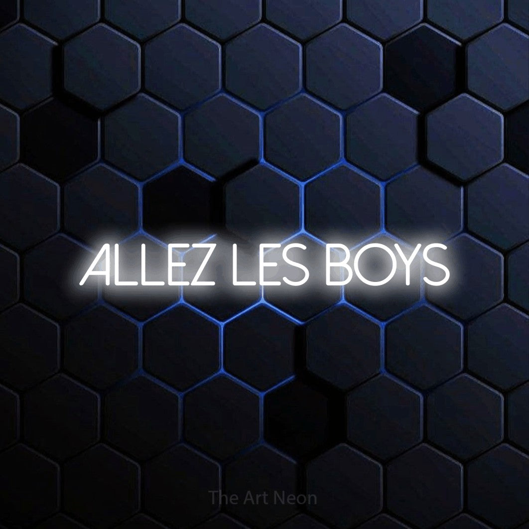 “Allez les boys” LED neon sign in cool white, with thin sans-serif lettering, shown against a dark blue honeycomb pattern.