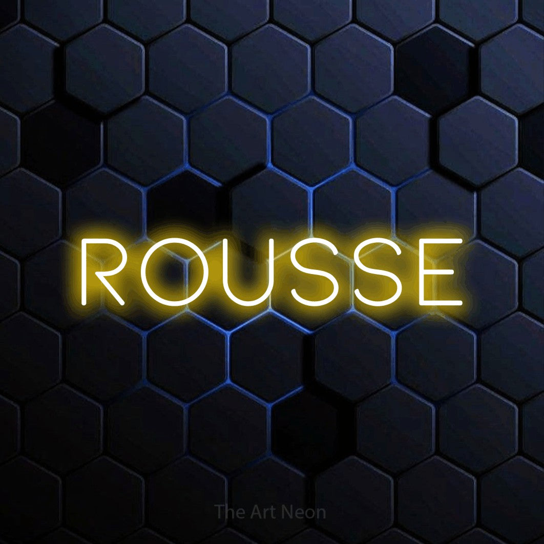 “Rousse” LED neon sign in yellow, with thin, widely spaced lettering, shown against a dark blue honeycomb pattern.