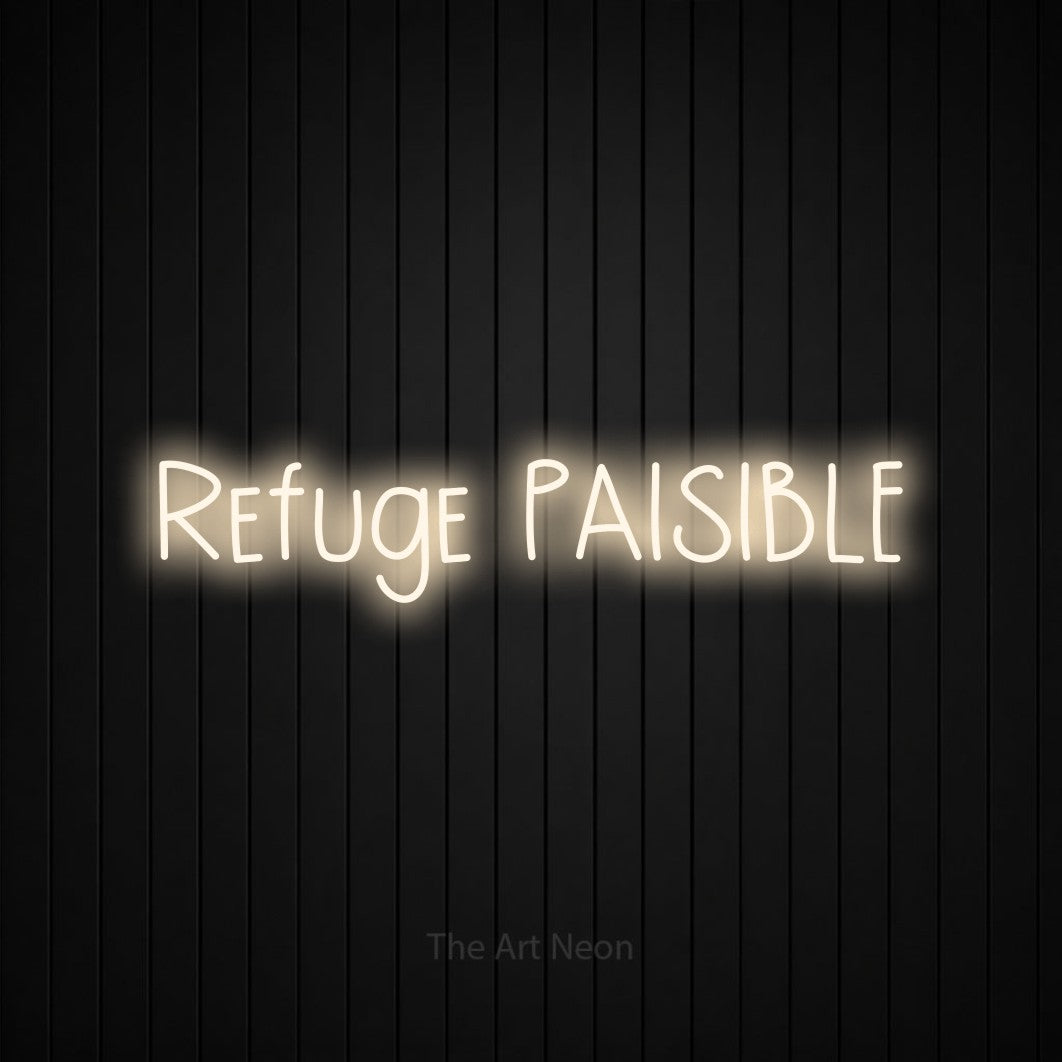 “Refuge paisible” LED neon sign in warm white, with narrow hand-drawn lettering, shown against black vertical wall slats.