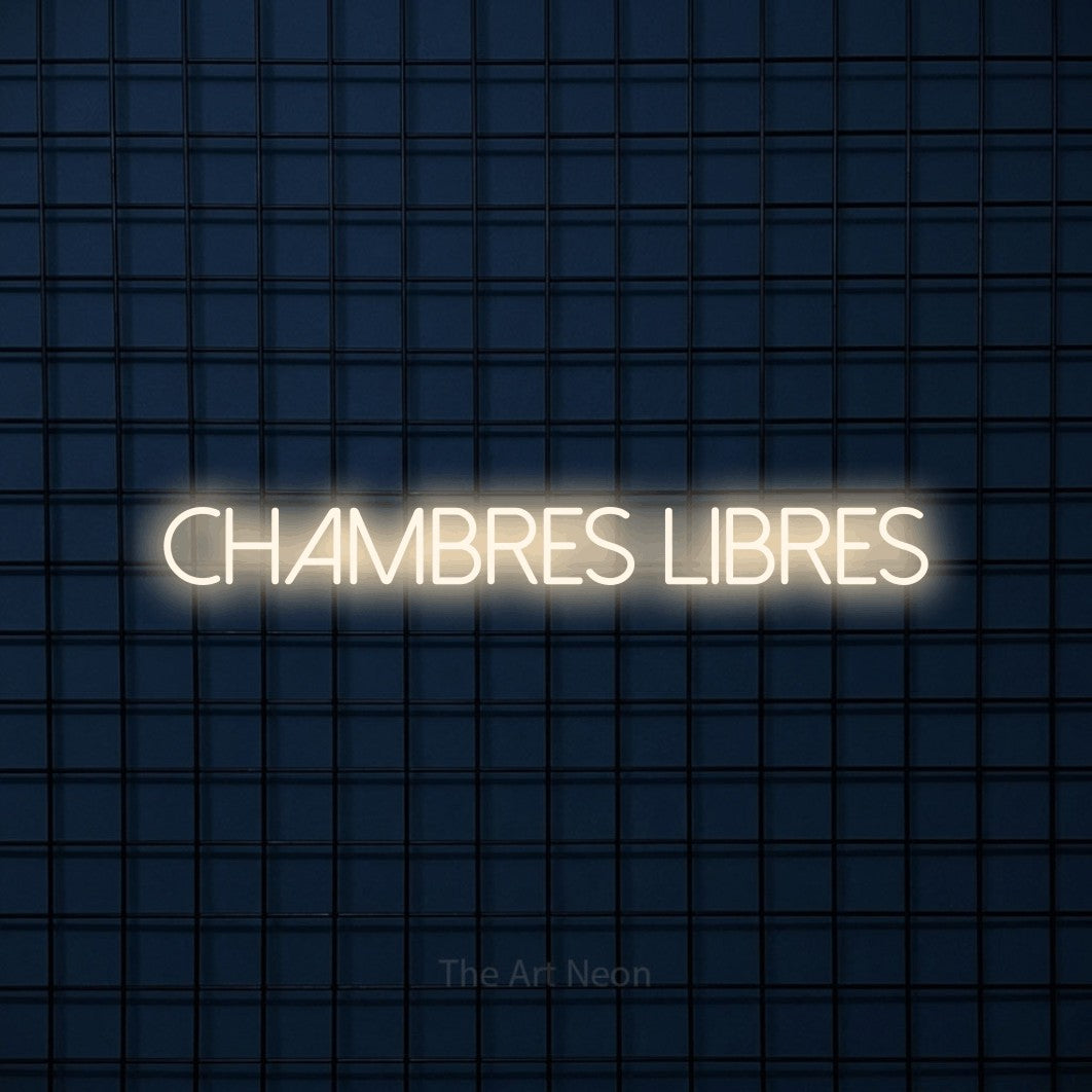 “Chambres libres” LED neon sign in warm white, with thin sans-serif lettering, shown against a dark blue grid.