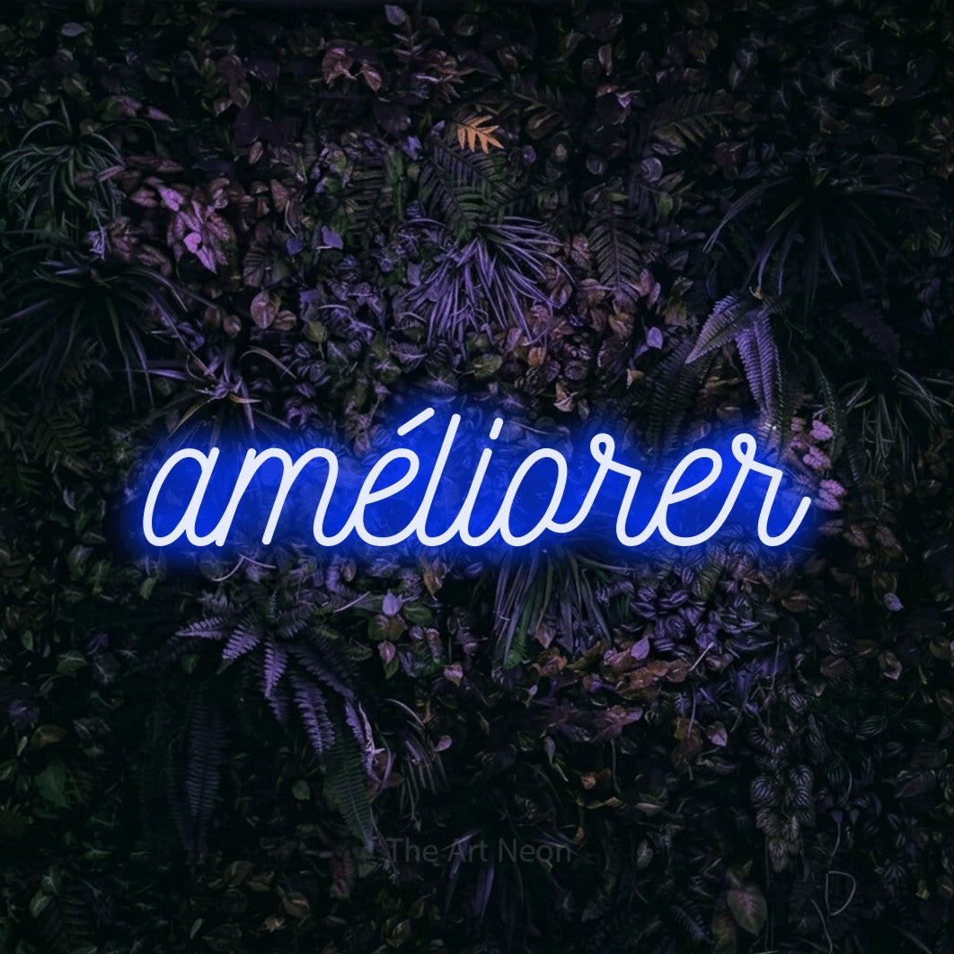 “Améliorer” LED neon sign in blue, with ornate cursive lettering, shown against a dark wall with purple flowers.