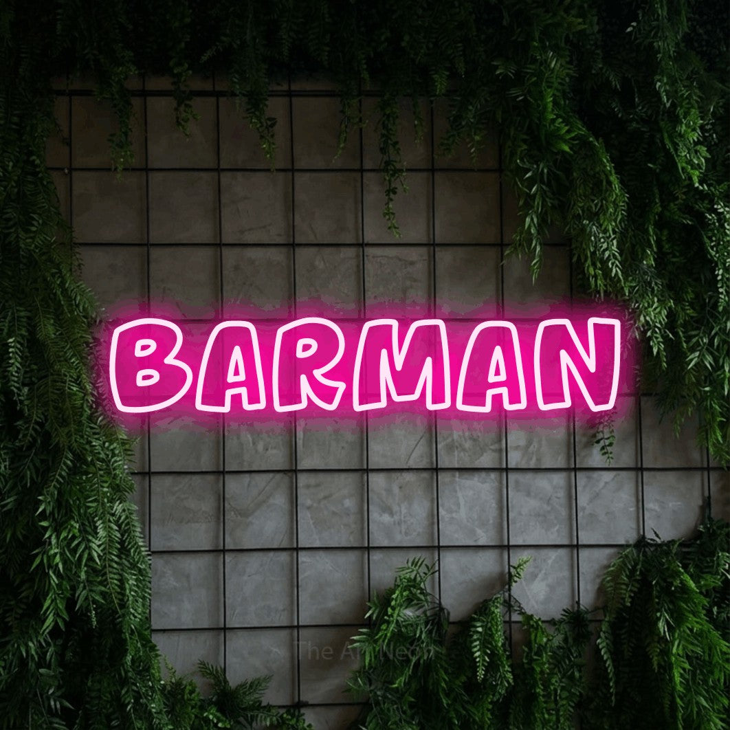 “Barman” LED neon sign in hot pink, with rounded outline lettering, shown against an ivy-covered concrete grid.