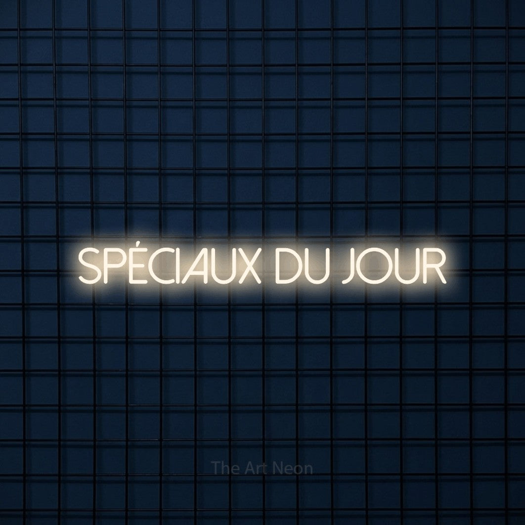 “Spéciaux du jour” LED neon sign in warm white, with thin sans-serif lettering, shown against a dark blue grid.
