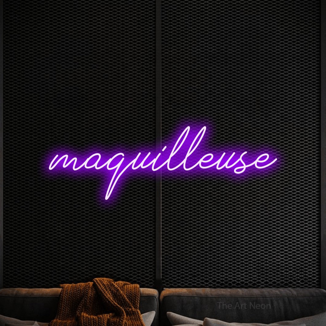 “Maquilleuse” LED neon sign in purple, with cursive lettering, shown against a modern dark-toned seating area.