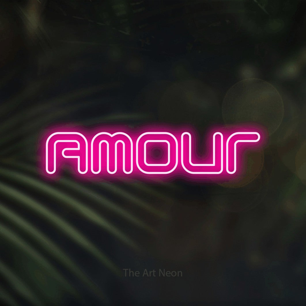 “Amour” LED neon sign in hot pink, with futuristic double-line lettering, shown against a blurred palm and bokeh-light backdrop.