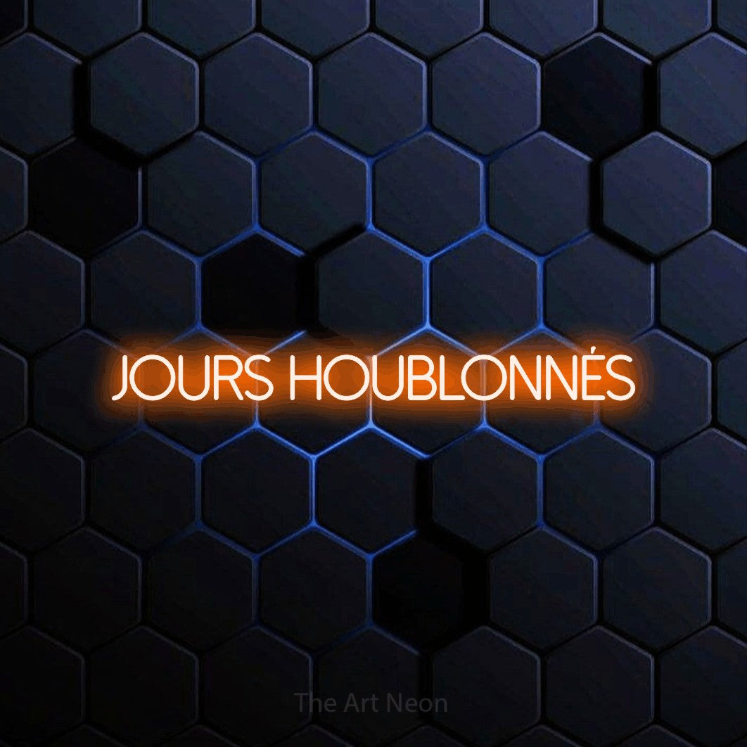 “Jours houblonnés” LED neon sign in orange, with thin sans-serif lettering, shown against a dark blue honeycomb pattern.
