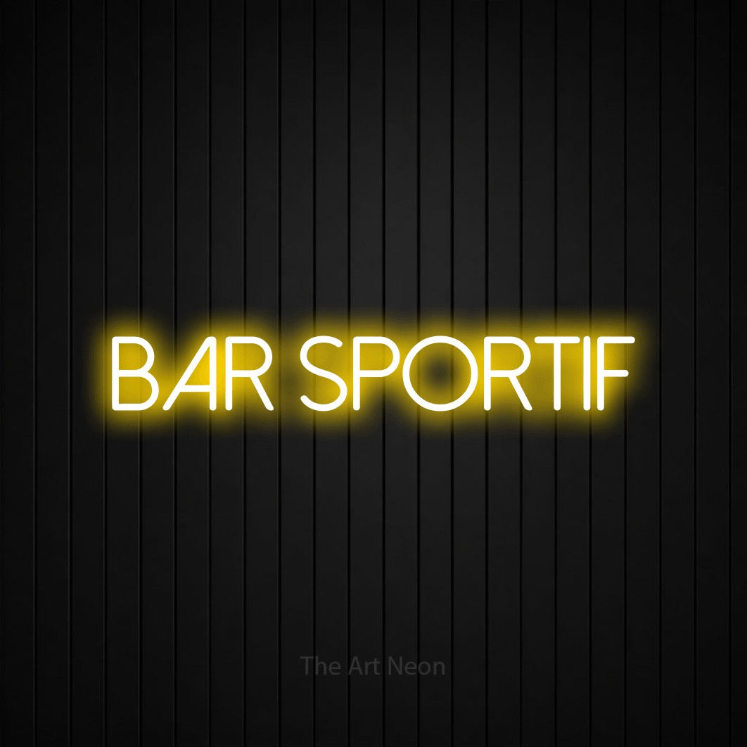 “Bar sportif” LED neon sign in yellow, with thin sans-serif lettering, shown against black vertical wall slats.