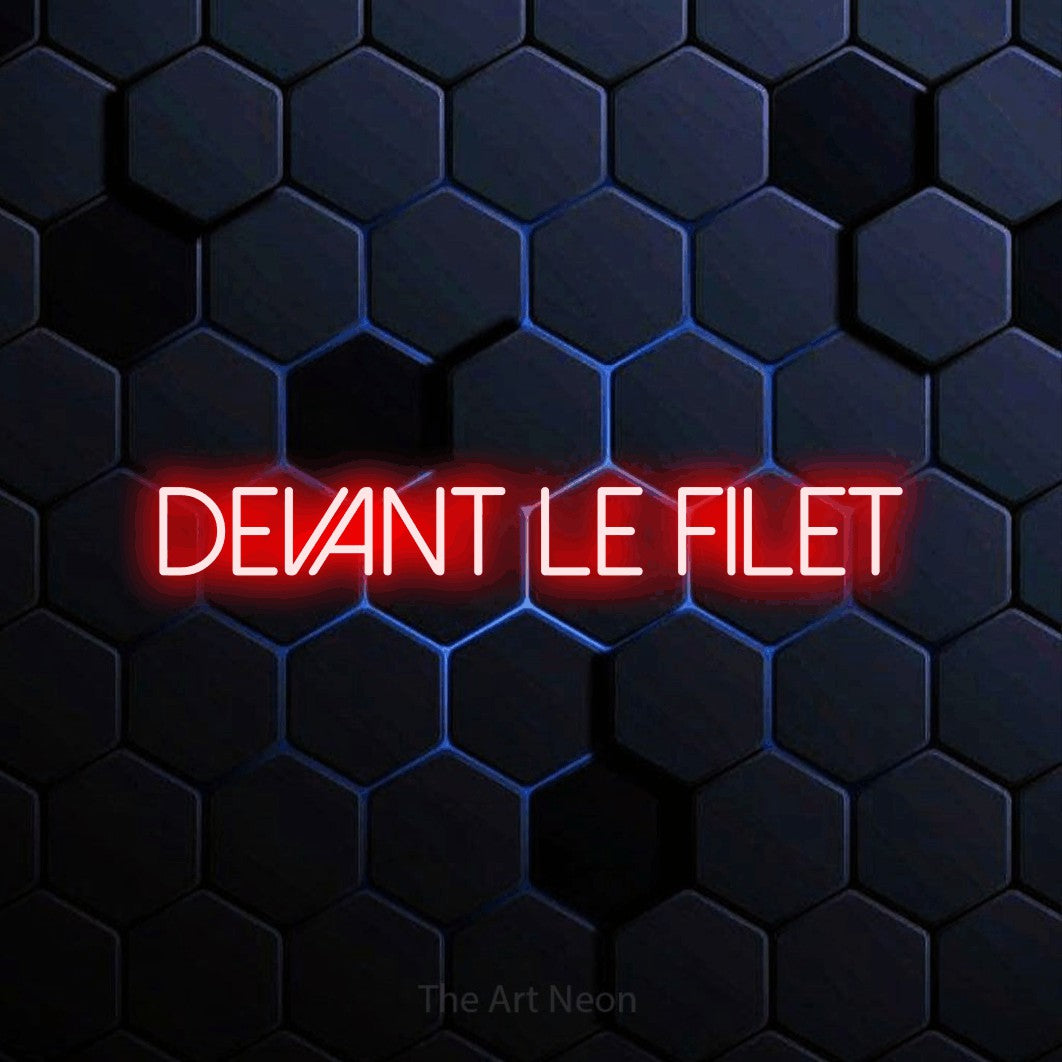 “Devant le filet” LED neon sign in red, with thin sans-serif lettering, shown against a dark blue honeycomb pattern.