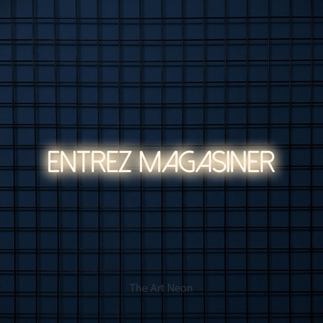 “Entrez magasiner” LED neon sign in warm white, with thin sans-serif lettering, shown against a dark blue grid.
